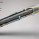 Cutaway of a multi-durometer Pebax catheter shaft showing braid reinforcement, a transition overlap, a softer distal jacket, and an etched PTFE liner.