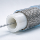 Cross-sectional illustration of a medical catheter with a PTFE tubing liner and guidewire.